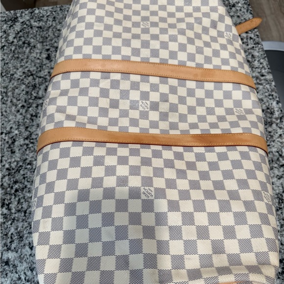 Louis Vuitton duffle bag, two of the straps are damaged as shown in pictures. - Picture 14 of 15